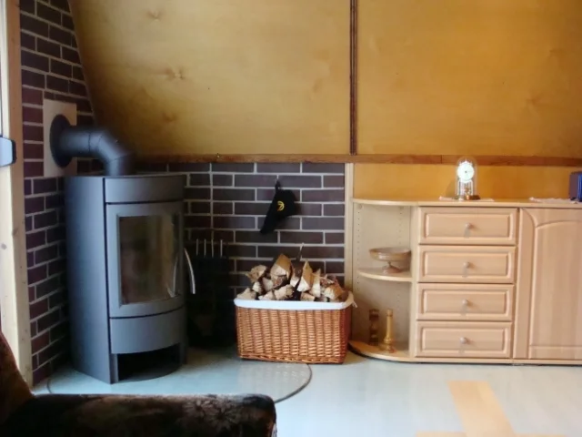 Bild: FH Villa Burgunde-Wohnzimmer mit Kaminofen