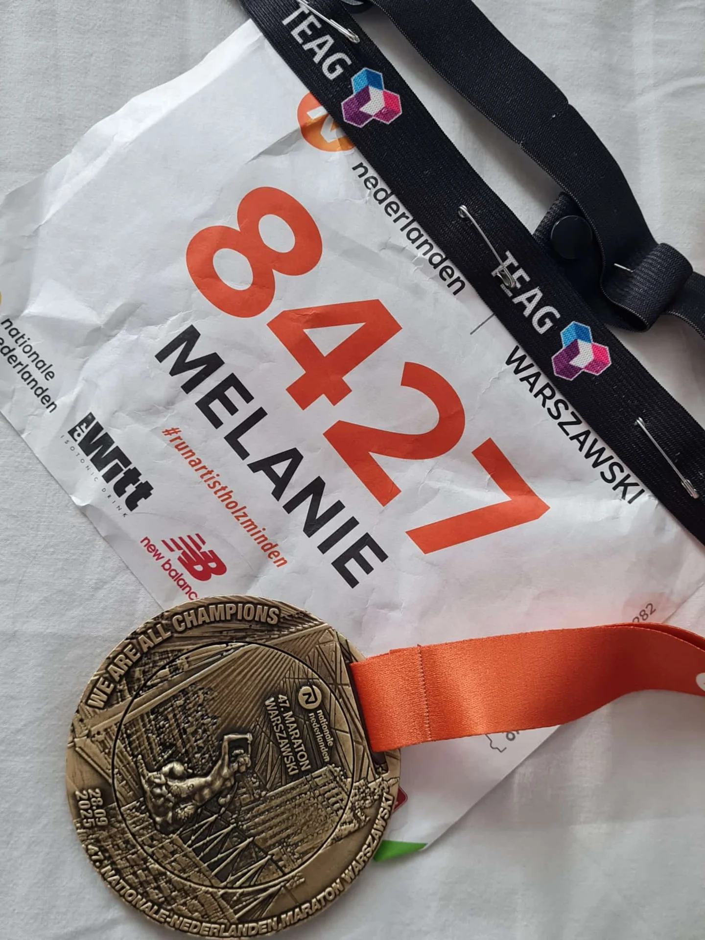 Startnummer und Medaille