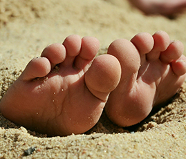 Füße in Sand