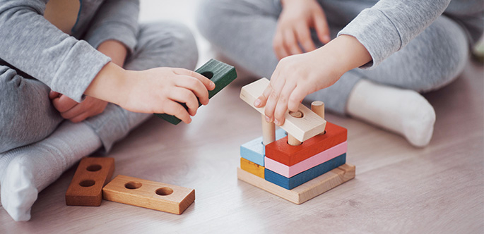 children-play-with-toy-designer-floor-children-s-room-two-kids-playing-with-colorful-blocks-kindergarten-educational-games
